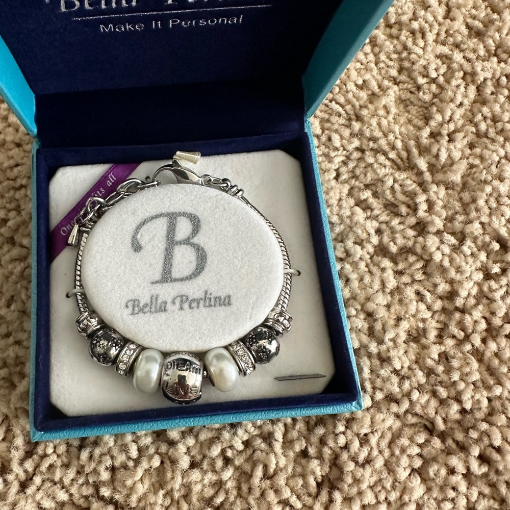 Bella Perlina charm bracelet. It has the words live laugh love on it.

New